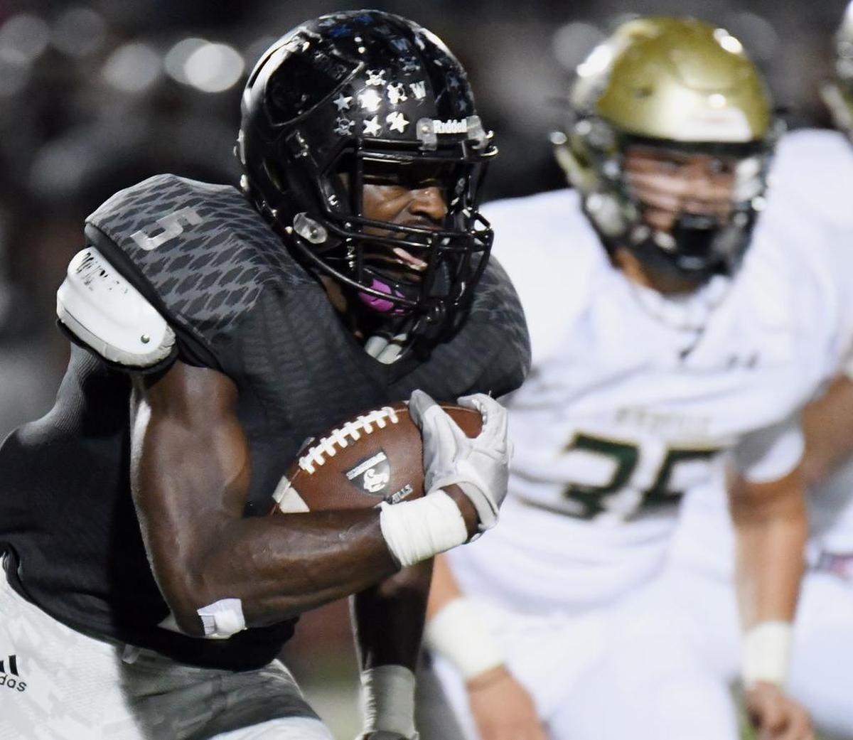 South Hills athlete Anthony Watkins (5) is pursued by Birdville’s Nick Martinez in a playoff game, Nov. 17, 2017.