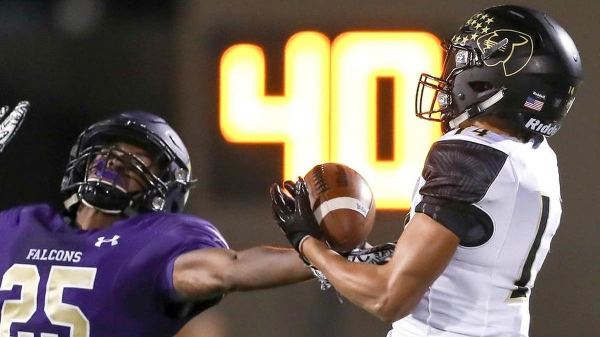Fossil Ridge wide receiver Jaylen Hearst, right, contests Timber Creek defensive back Emmanuel Wilson (25) for the ball in a Week 4 game.