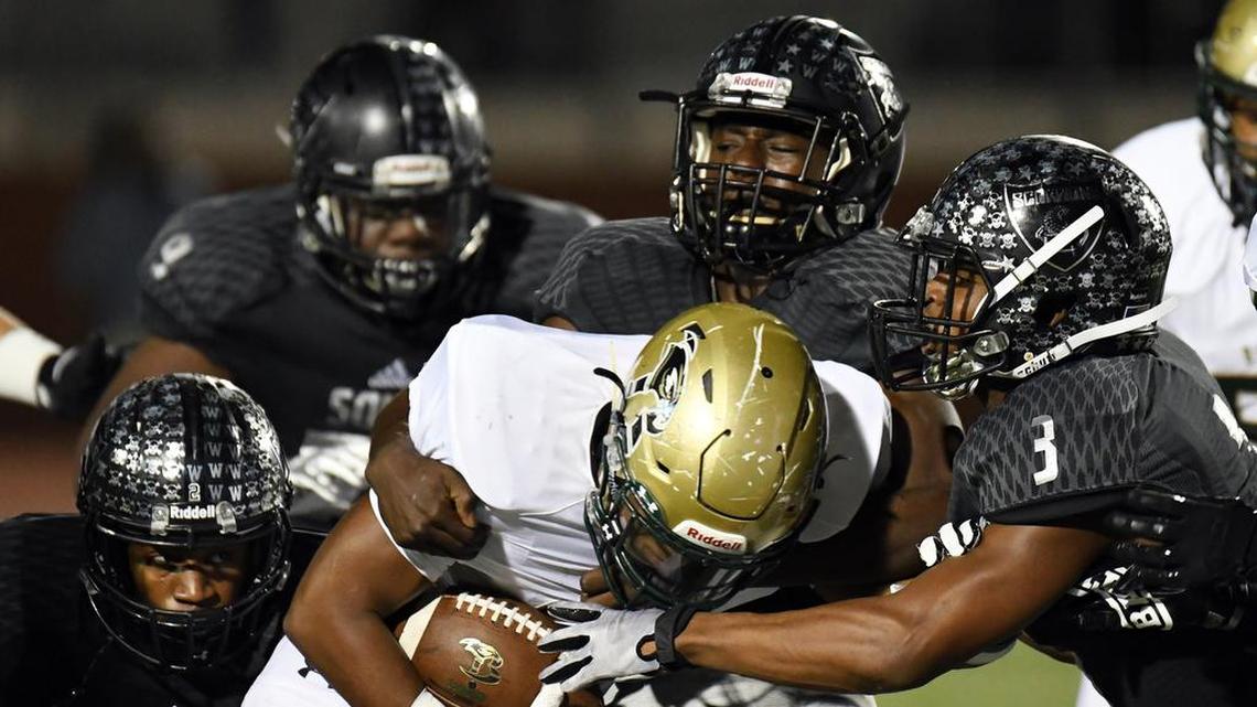 Birdville's Laderrious Mixon, center, and the Hawks’ season ended at the hands of Denton Ryan.