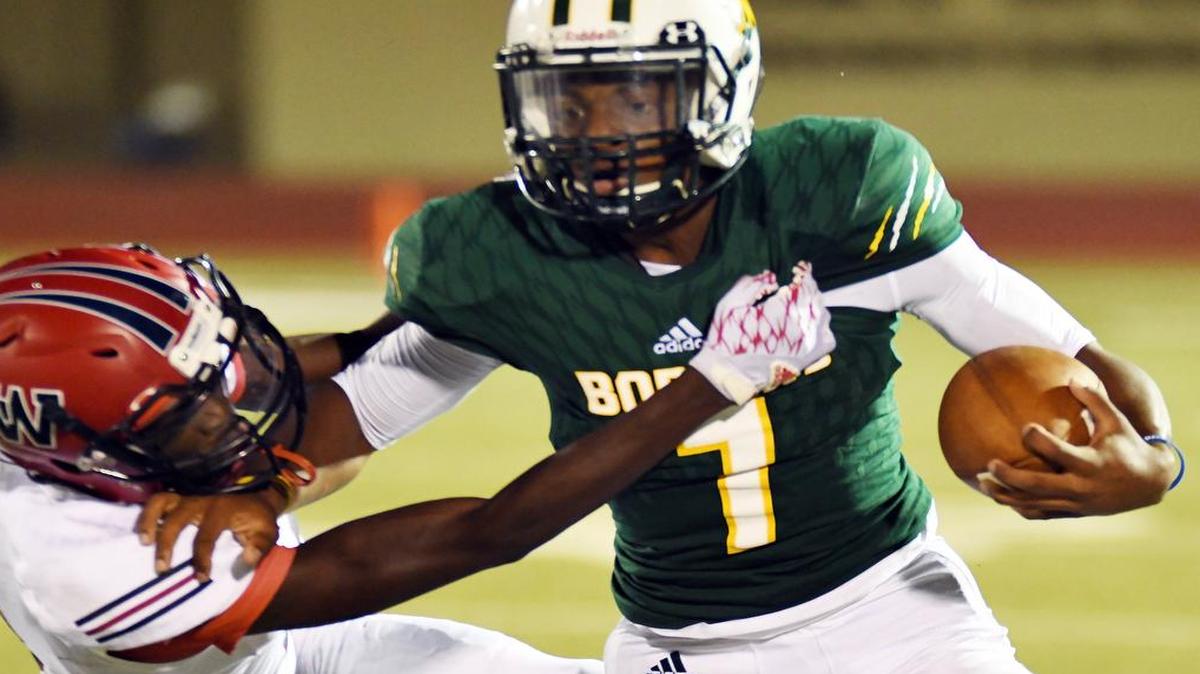 Waxahachie Life defender Jordan Poston, left, goes for the tackle on Benbrook's Quintan Jackson.