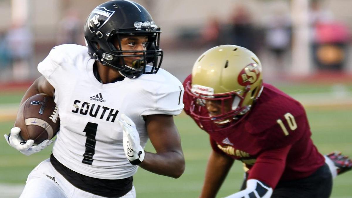 South Hills's Trey Jones, left gets away from Saginaw's Isaiah Bowen after a catch and run for a first down during the first quarterf of Friday's, September 2, 2016 football game at Rough Rider Stadium in Saginaw.