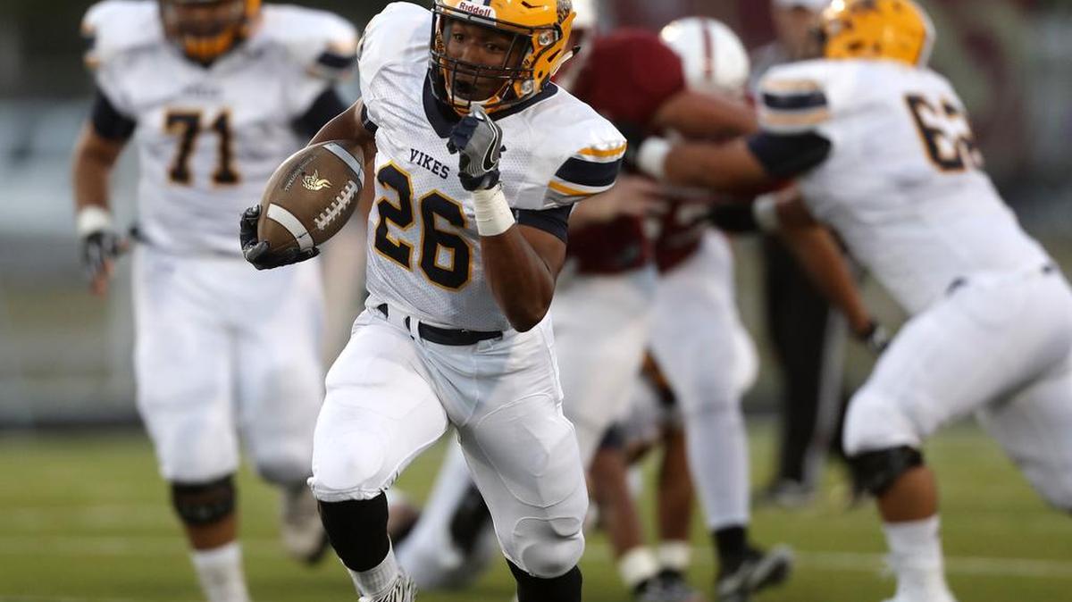 Lamar running back Desmond Moultrie breaks away for long yardage as the Vikings played Keller Central in high school football at KISD Athletic Complex, Sept. 14, 2017.