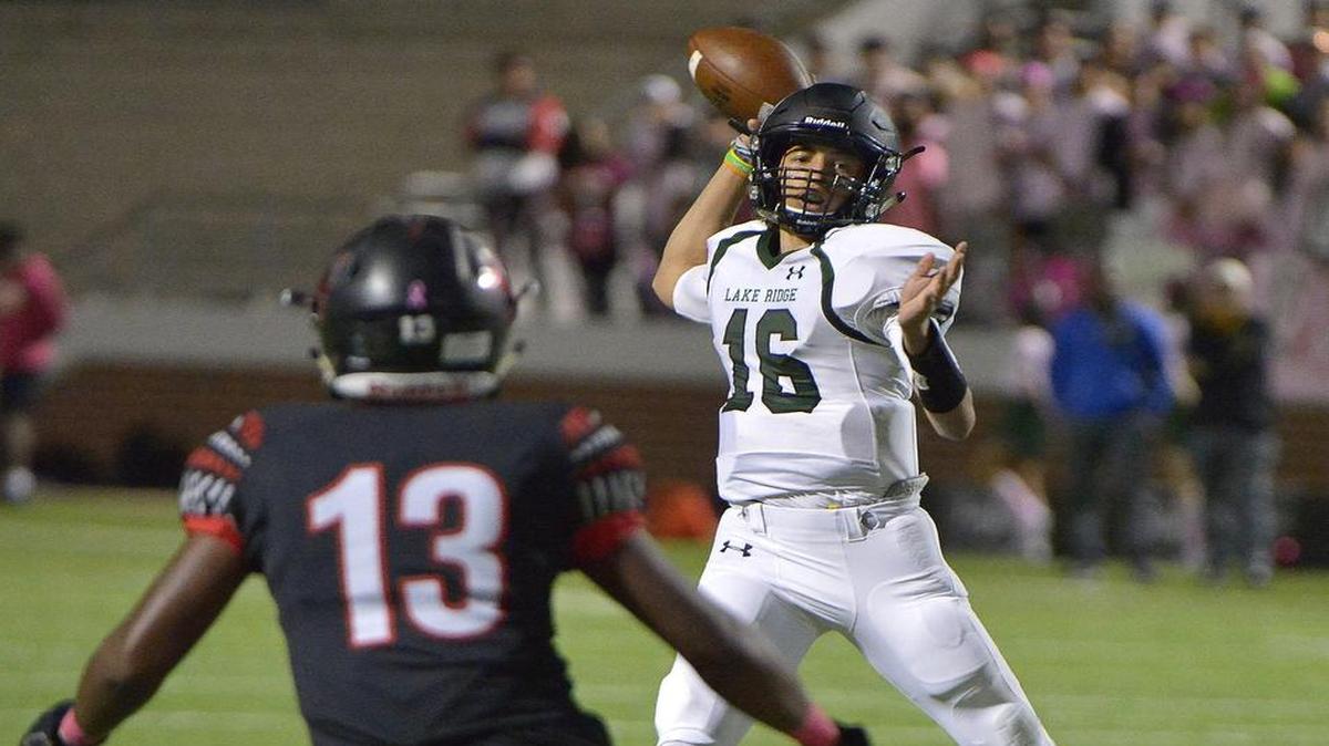 Lake Ridge Eagles quarterback Jason Bean (16) throws a touchdown pass over Mansfield Legacy Broncos Carlon Eggins (13) during the first quarter as Mansfield Lake Ridge plays Mansfield Legacy at Newsom Stadium in Mansfield, TX, Friday, Oct. 21, 2016.