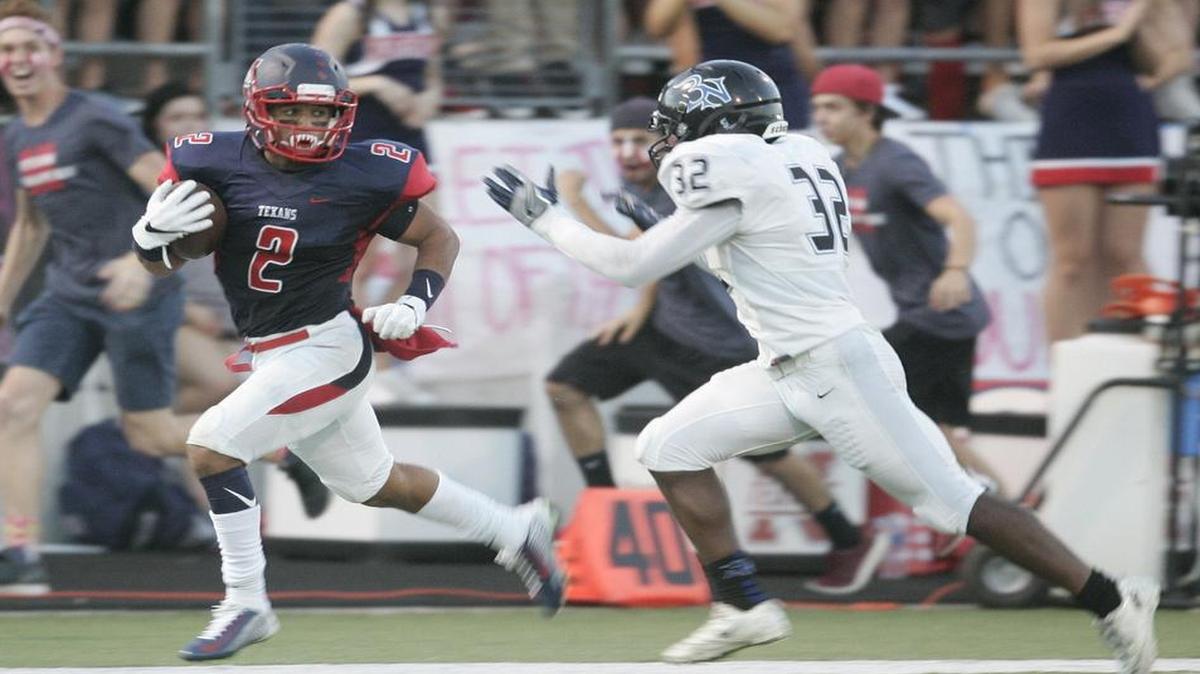 Northwest’s Syrus Moore (2) outruns Byron Nelson's Jaylen Perry for a long gain in a high school football game at NISD Stadium Friday night Sept. 09, 2016.