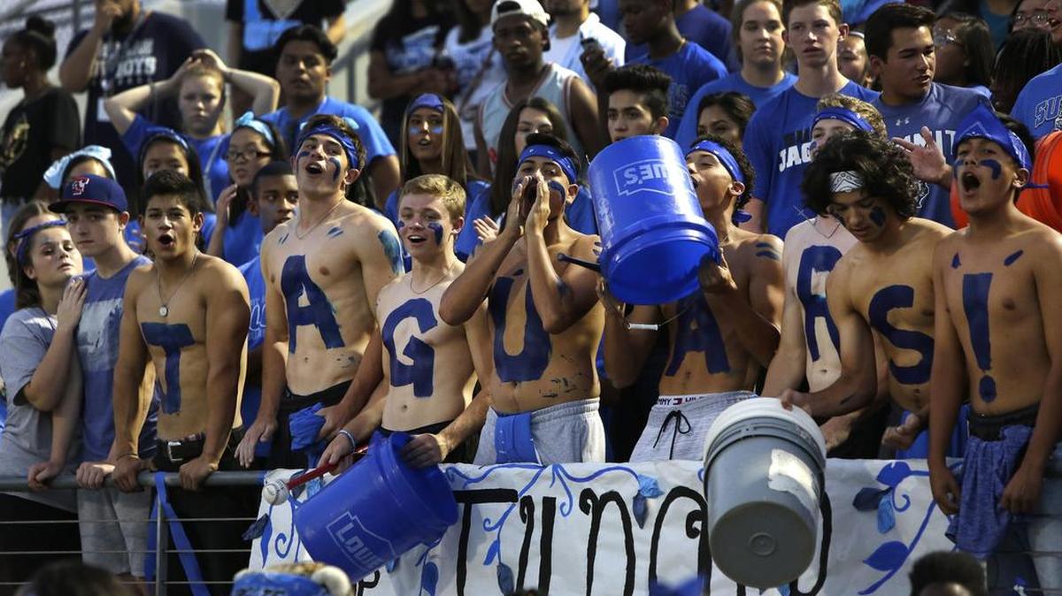 Mansfield Summit Jaguars fans cheer their team in an early-season game at Newsom Stadium in Mansfield.
