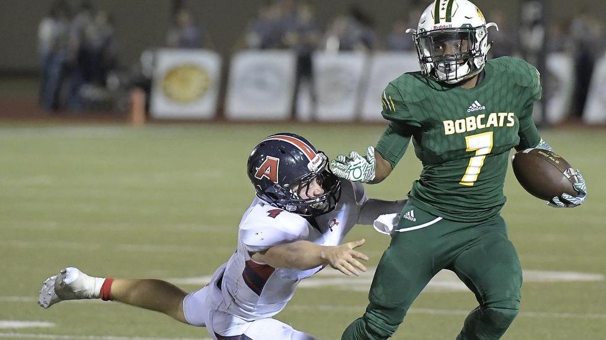 Benbrook Bobcats running back Quintan Jackson (7) is able to make the Aubrey Chaparrals’ Spencer Neumann (4) miss the tackle on this second quarter play.