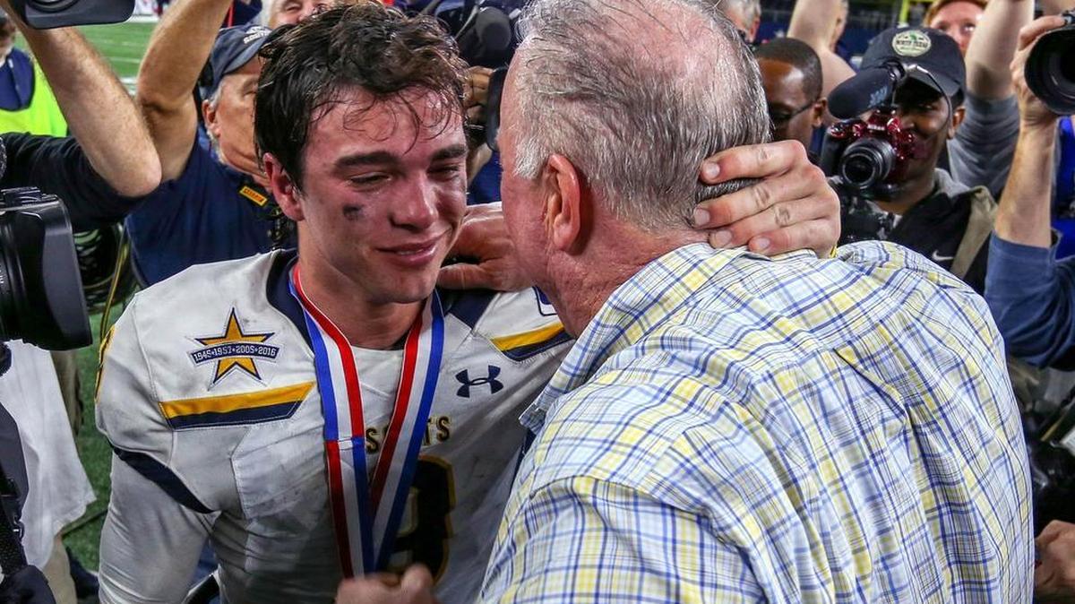 Highland Park quarterback John Stephen Jones and his father Stephen Jones celebrate after beating Manvel, 53-49, for the UIL Class 5A Division I state championship at AT&T Stadium, Dec. 22, 2017.