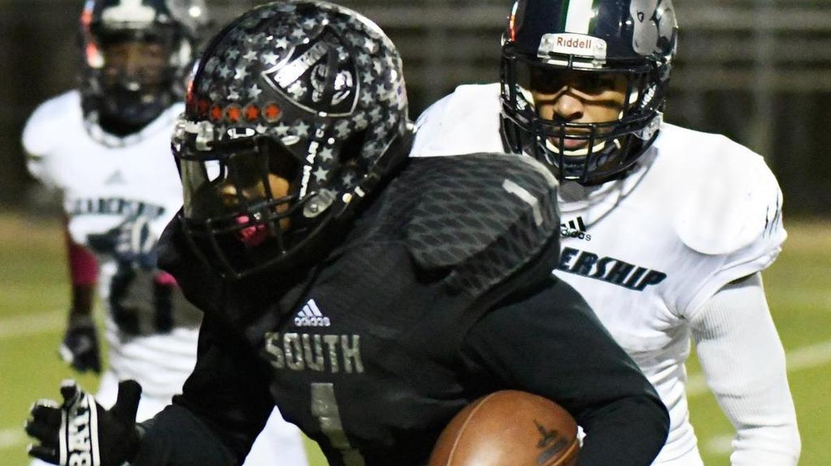 South Hills quarterback Trey Jones (1), evading YMLA defenders in Week 9 game, has rushed and passed for nearly 1,700 yards.