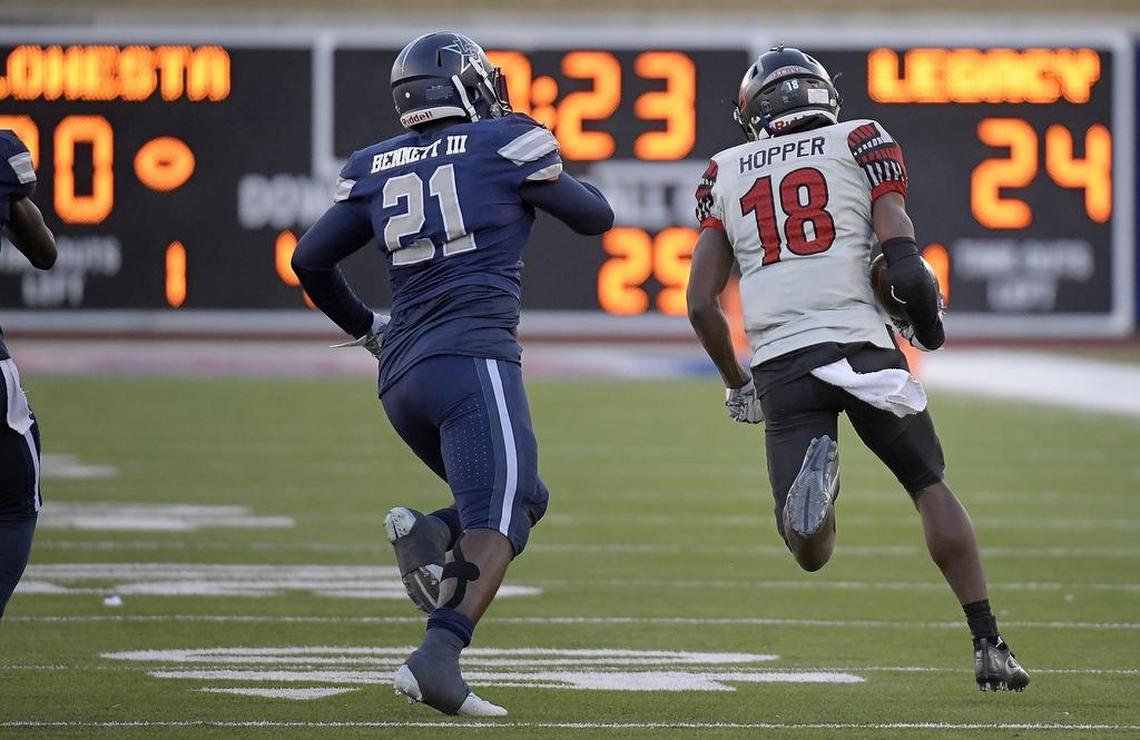 Mansfield Legacy strong safety Jared Hopper (18) returns a fumble against Frisco Lone Star at Gerald J. Ford Stadium in Dallas, Dec. 9, 2017.