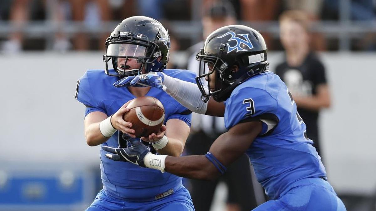 Byron Nelson quarterback Nicholaus Santini (13) hands the ball off to Jordan Joiner (3) against Northwest. The duo has keyed the Nelson offense.