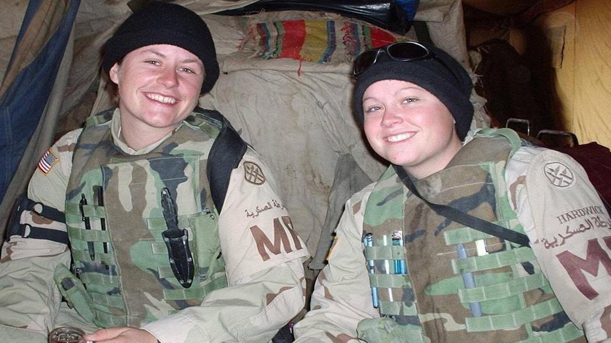 Brooke Brittain, left, and fellow soldier Sheena Hardwick enjoys some down time in Iraq, 2003.