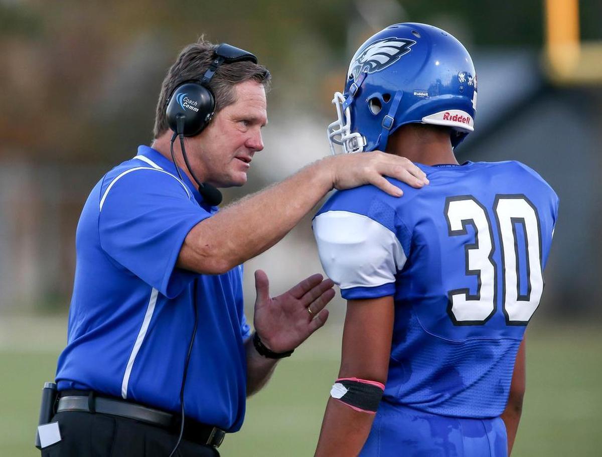 Carter-Riverside coach Jim Jeffries talks with wide receiver Tony Collins last season. Collins was named the sophomore offensive MVP last season.