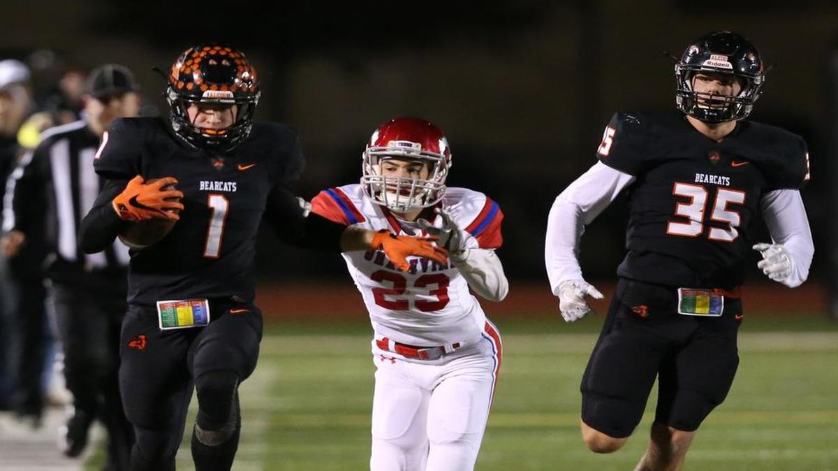 Aledo WR Logan Bridges (1) breaks away from Grapevine’s Blake Stiles (23) on a touchdown run as Aledo’s Preston Jefferis (35) looks on Friday, November 18, 2016.