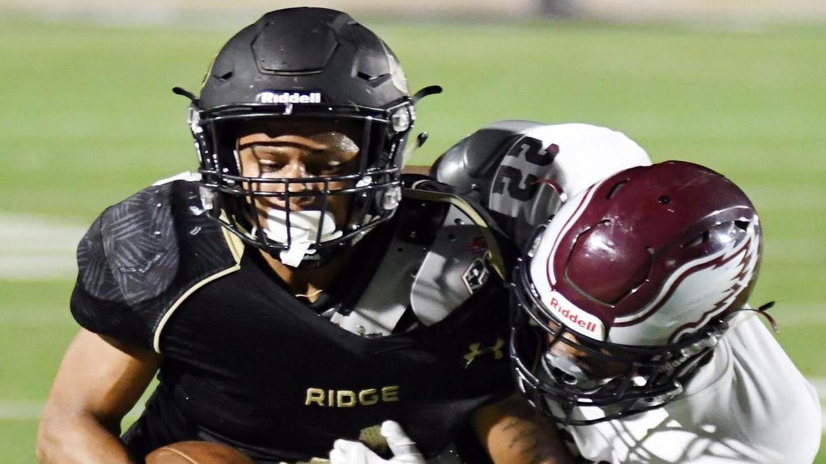 Fossil Ridge receiver Elijah Hicks, left, is brought down by Rowlett’s Jakel Davis, Sept. 16, 2016.