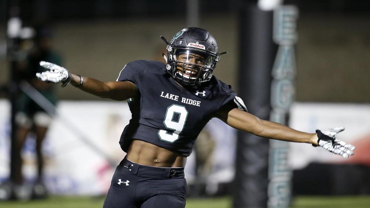 Mansfield Lake Ridge Eagles defensive back David Wilson (9) reacts to scoring a touchdown after intercepting Lancaster.