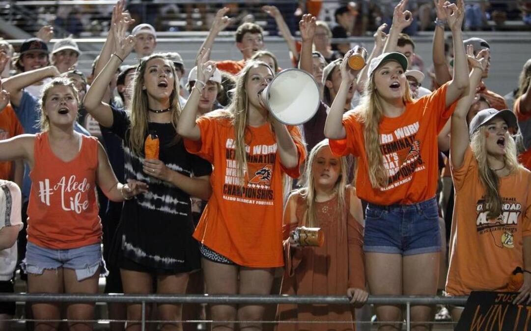 Aledo Bearcats fans cheer their team in the second half of high school football action against the Mansfield Legacy Broncos at Newsom Stadium in Mansfield, Texas Friday, Sept. 9, 2016.