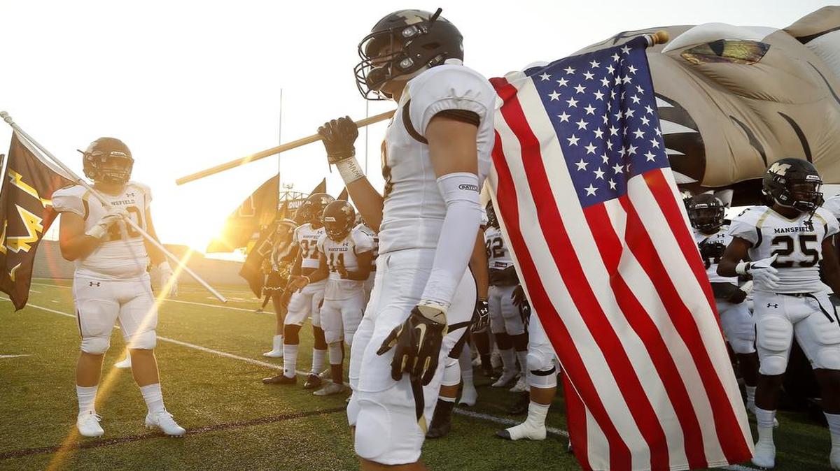 Mansfield wideout Jackson Gleeson (8) prepares to lead the Tigers onto the field against Mansfield Summit at Newsom Stadium in Mansfield, Sept. 1, 2017.