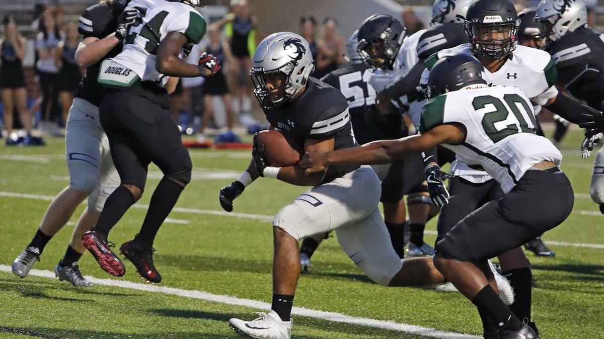 Guyer running back Devin Jefferson (20) races for a score in the second quarter against Mansfield Lake Ridge, Aug. 31, 2017.