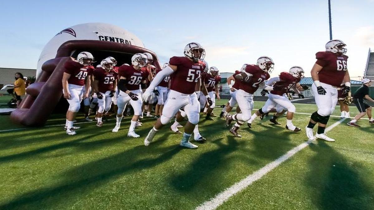 Keller Central football team takes the field before at game at Keller ISD Stadium.