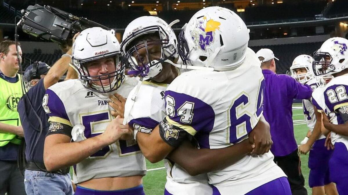Mart players celebrate after defeating Refugio, 34-21, Wednesday night, December 20, 2017 in the high school football 3A Division I State Champion game played at AT&T Stadium in Arlington.