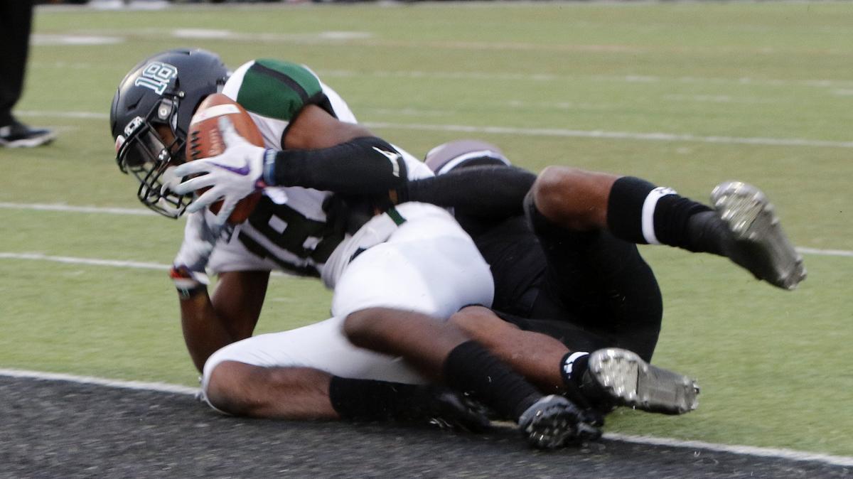 Lake Ridge wide receiver Keylan Johnson (18) grabs the winning touchdown in the third overtime period of an area round high school football playoff game at Pennington Field in Bedford, Texas, Saturday, Nov. 24, 2018. Tied at 28 after regulation Lake Ridge held on to win 50-42 in three overtimes.. (Star-Telegram Bob Booth)

