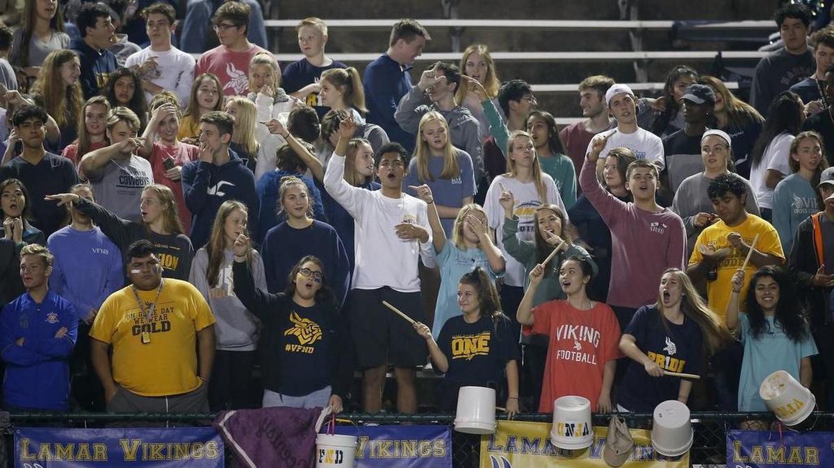 Arlington Lamar fans cheer for the Vikings in a playoff game against Haltom at the Gopher-Warrior Bowl, Nov. 16, 2017.