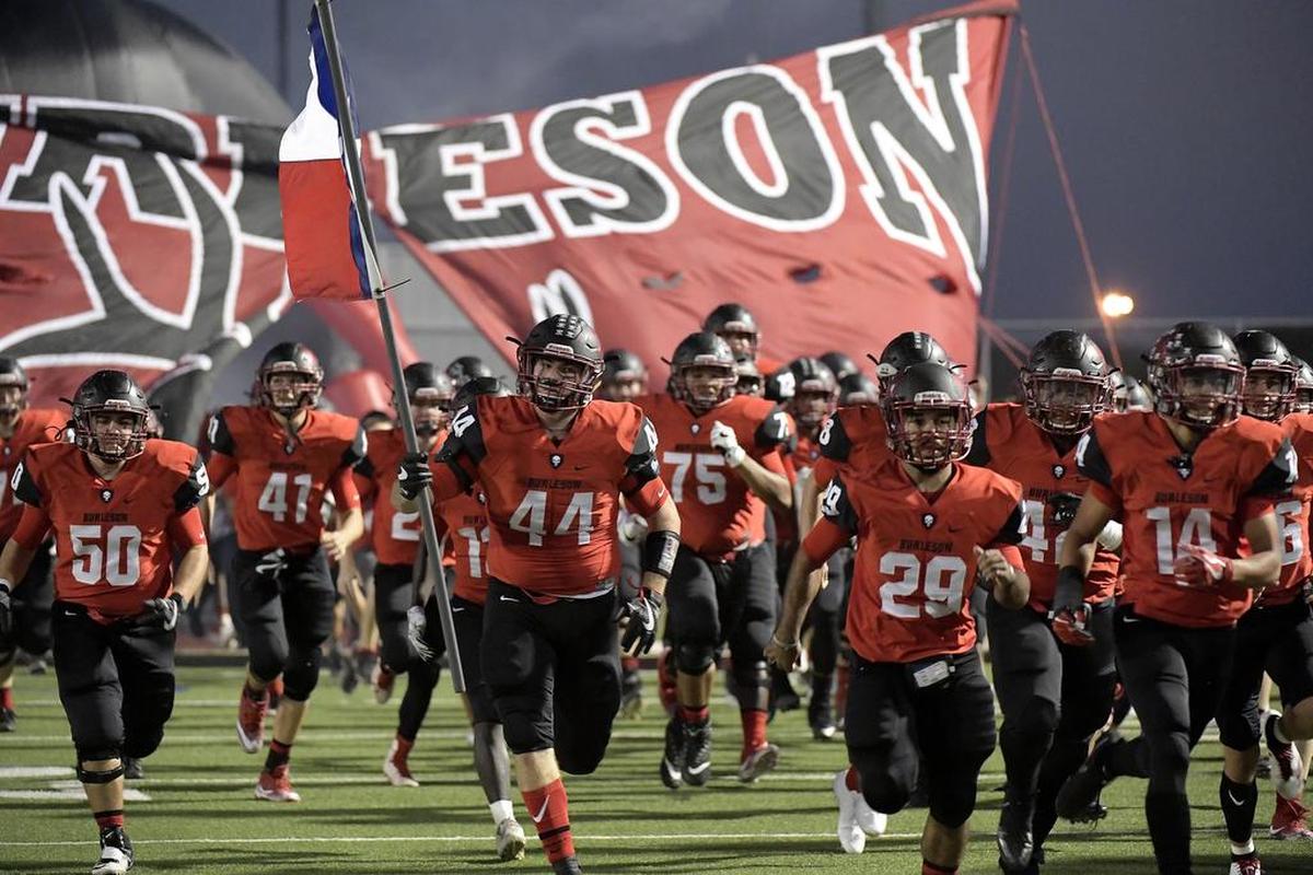 Burleson Elks players take the field against Joshua at Burleson ISD Stadium in October.