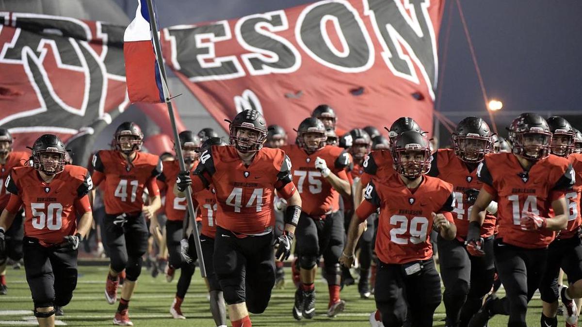 Burleson Elks players take the field against Joshua at Burleson ISD Stadium in October.