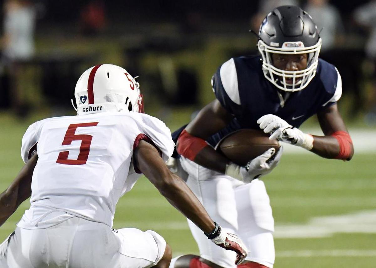 Richland’s Rashee Rice, right, and Keller Central’s DJ Graham.