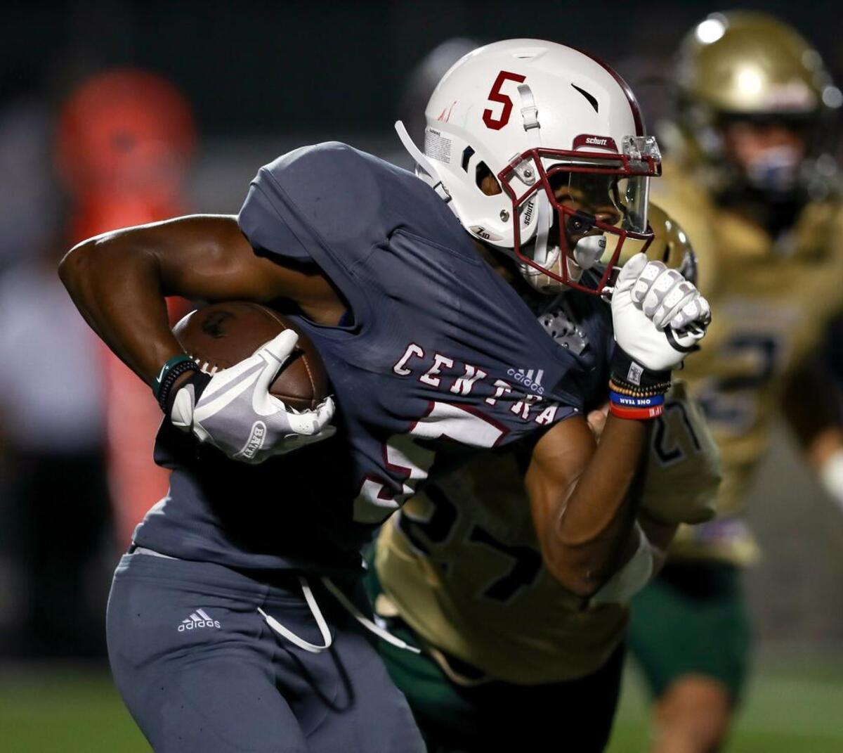 Keller Central’s D.J. Graham looks for running room against Birdville on Thursday during the Chargers’ 17-16 victory.