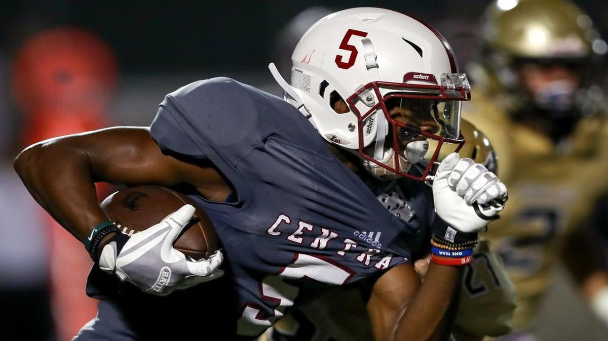 Keller Central’s D.J. Graham looks for running room against Birdville on Thursday during the Chargers’ 17-16 victory.