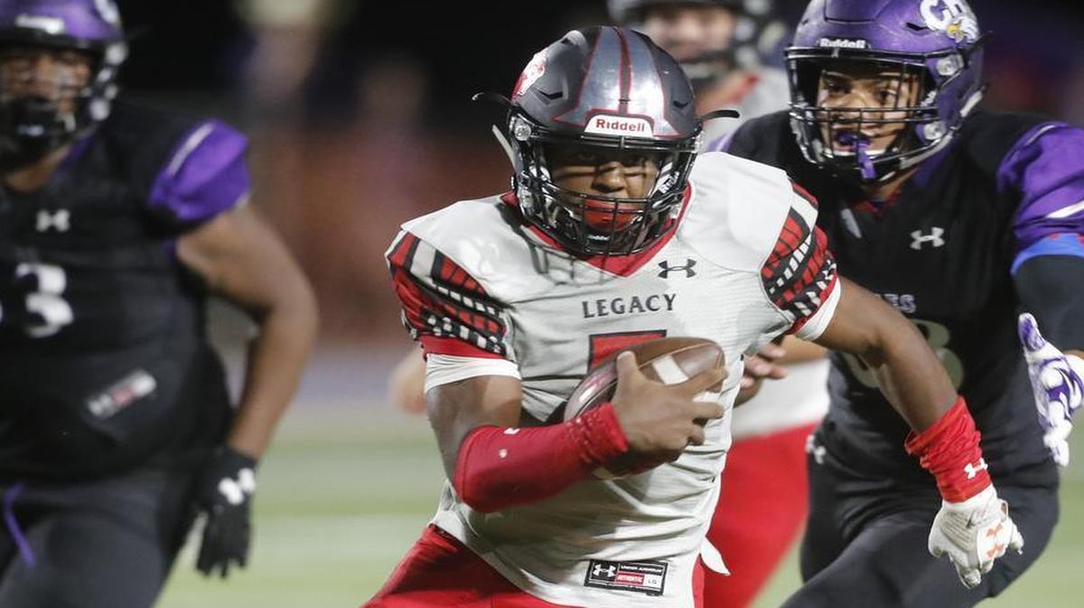 In a Sept. 8 game against Crowley, Jalen Catalon (5) gets yardage on a quarterback keeper as Mansfield Legacy.