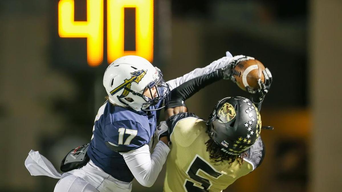 Brett Garcia of Keller nearly gets a pick against Fossil Ridge’s Stefan Cobbs in the season finale.