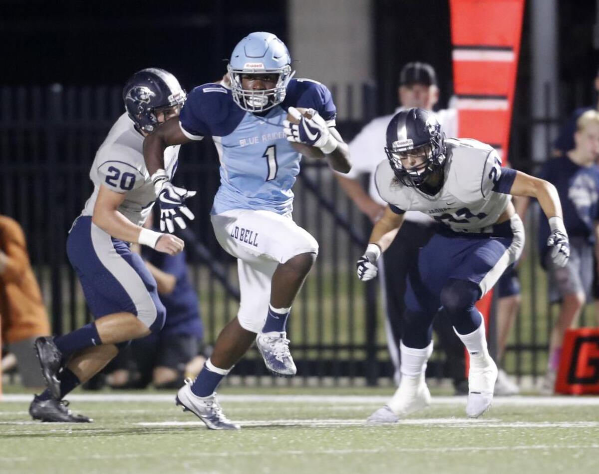 L.D. Bell running back Zion Hardy (1) takes off for long yardage as Flower Mound played L. D. Bell in high school football at Pennington Field Friday October 13, 2017.