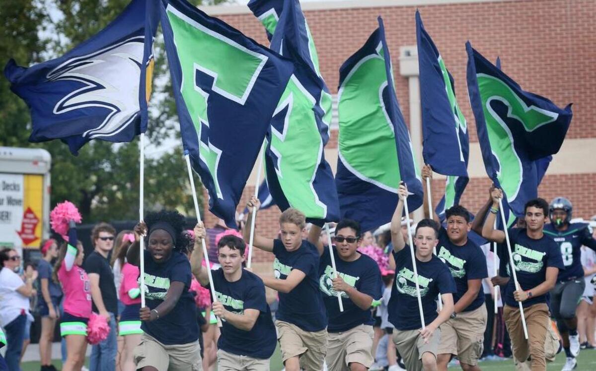 Members of the Haslet Eaton spirit team run the field at Northwest ISD Stadium, Oct. 15, 2016.