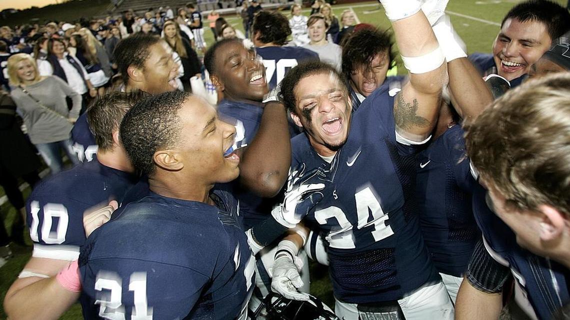 All Saints safety Chris Lane (24) celebrates with seniors after they defeated St. John to advance to the SPC championship on Nov. 2, 2013.