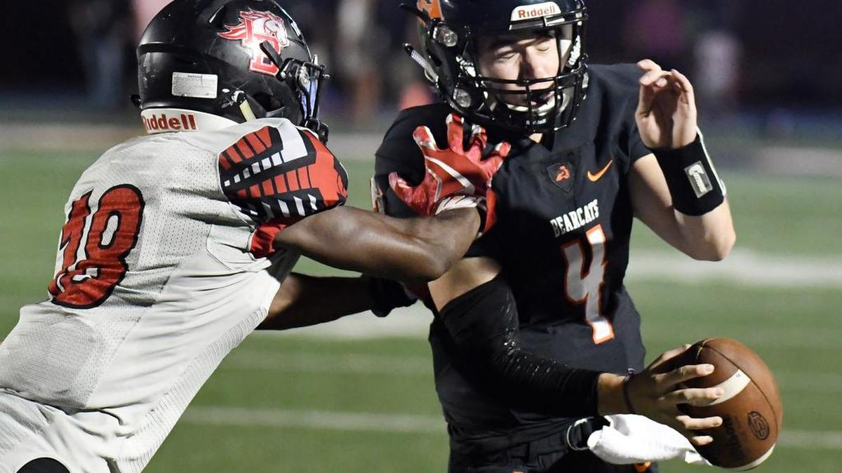 Aledo quarterback Jake Bishop, right is pushed out of bounds by Legacy’s Jared Hopper after scrambling for a first down in the fourth quarter.