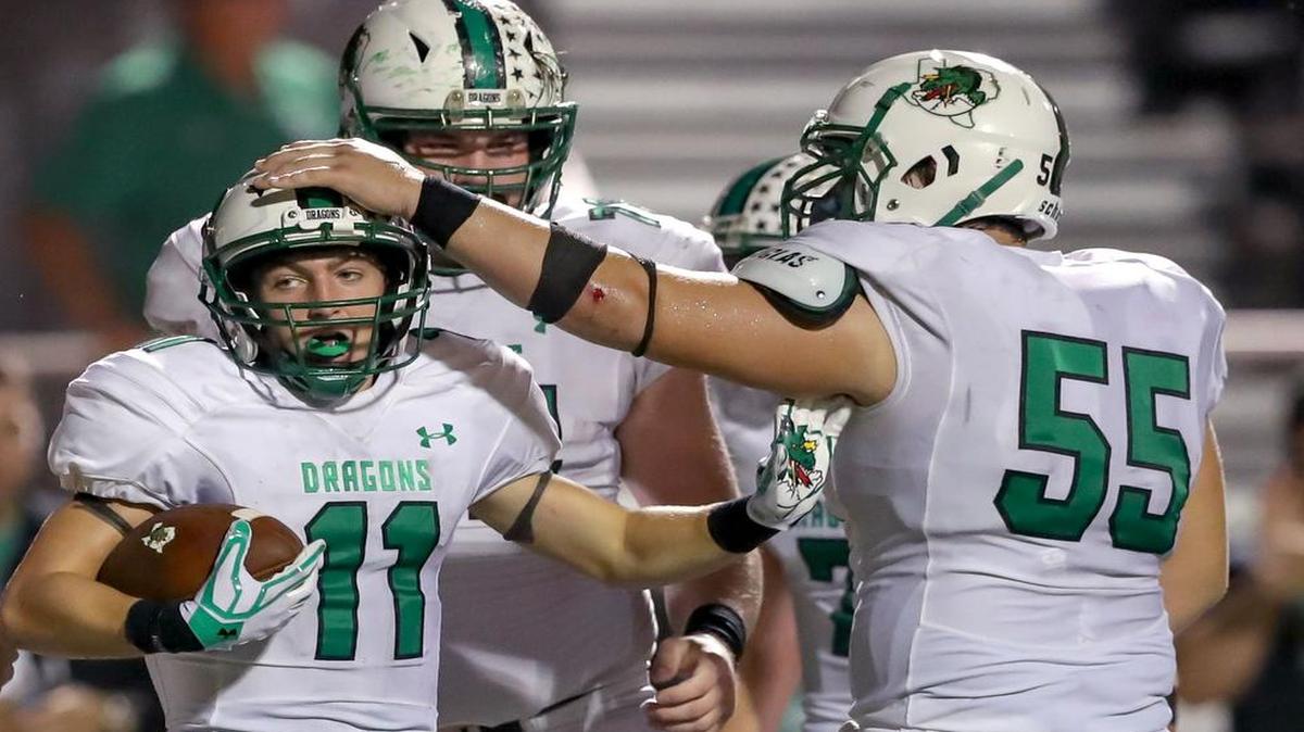 Southlake Carroll wide receiver Jackson Davis (11) celebrates a touchdown with teammates against Flower Mound Marcus, October 14, 2016.
