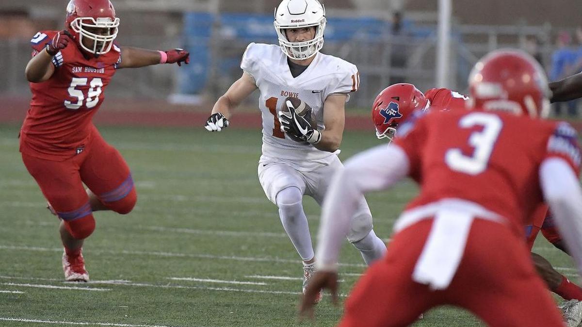 Bowie Volunteers receiver Ty DeArman (10) scrambles for yards as Sam Houston Texans Steven Delorbe (58) closes in during the first quarter as Bowie plays Sam Houston at Wilemon Field in Arlington, TX, Thursday, Oct. 5, 2017.