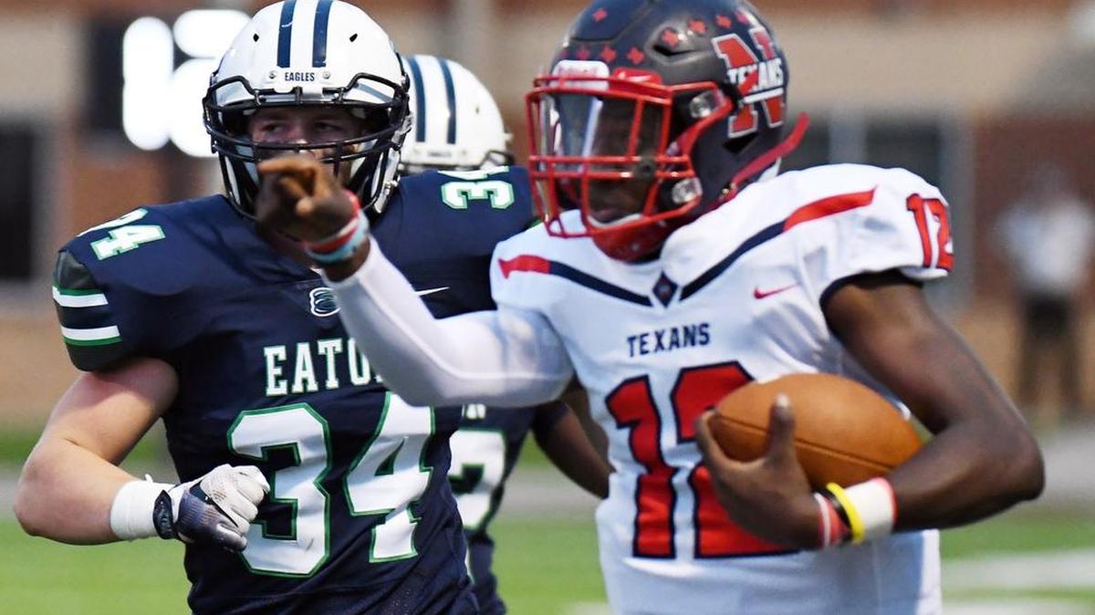 In a Week 4 game against Haslet Easton, Northwest quarterback Prince Mavula (12) races for yardage.