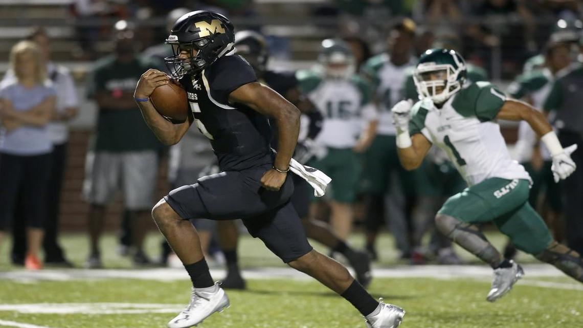 Mansfield Tigers running back Kennedy Brooks (5) runs past the Arlington Colts defense in a high school football game at Newsom Stadium, Friday, Sept. 30, 2016.