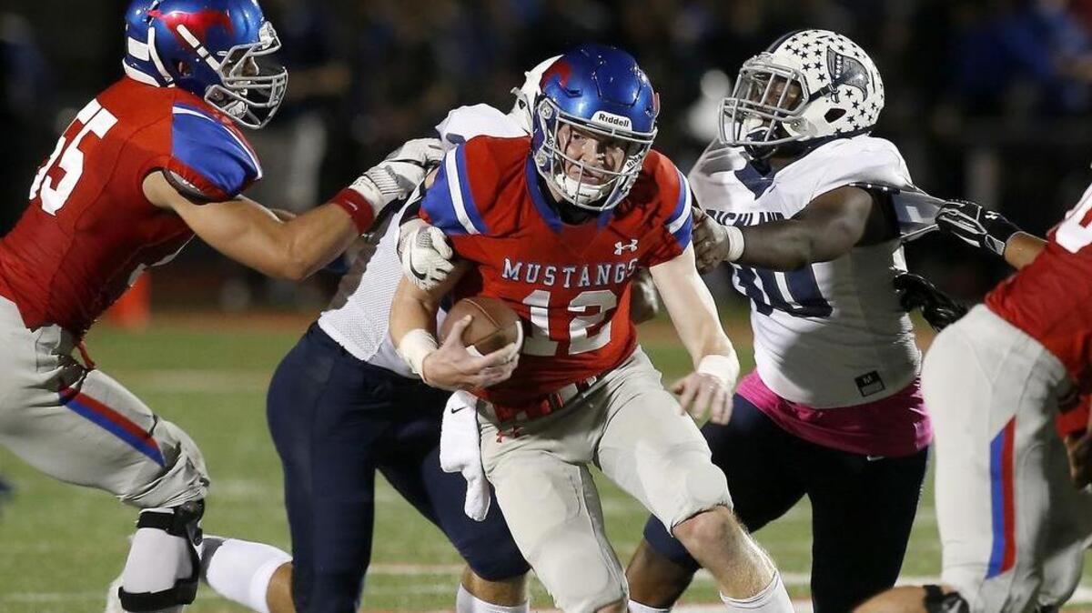 Grapevine Mustangs quarterback Alan Bowman (12) escapes pressure in the pocket against the Richland Rebels Friday.