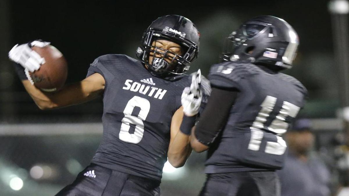 South Hills wide receiver Omuiri Garcia (8) celebrates a touchdown catch with teammate Jayden Champion (15) in the first half against Seagoville, Sept. 1, 2017.