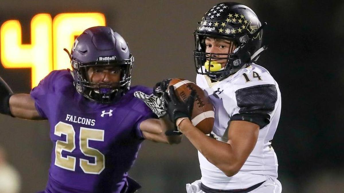 Keller Fossil Ridge wide receiver Jaylen Hearst (14) makes the reception against Keller Timber Creek defensive back Emmanuel Wilson (25) during the 1st half Friday night, September 29, 2017 played at Keller ISD AC.