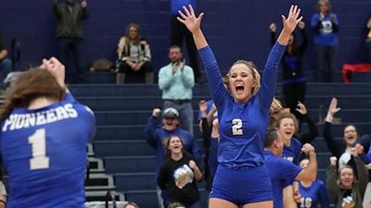 Kylie Courtney (2) and Saginaw Boswell teammates celebrate a playoff win against Sherman, Oct. 31, 2017.