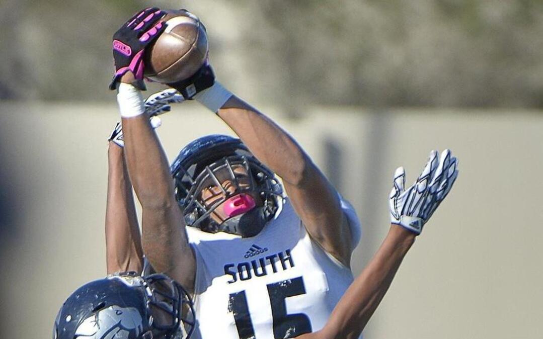 South Hills WR Calvin Clater (15) intercepts the ball intended for YMLA Tyson Haynes-Jones (1) during the second quarter Saturday, Oct. 22, 2016.