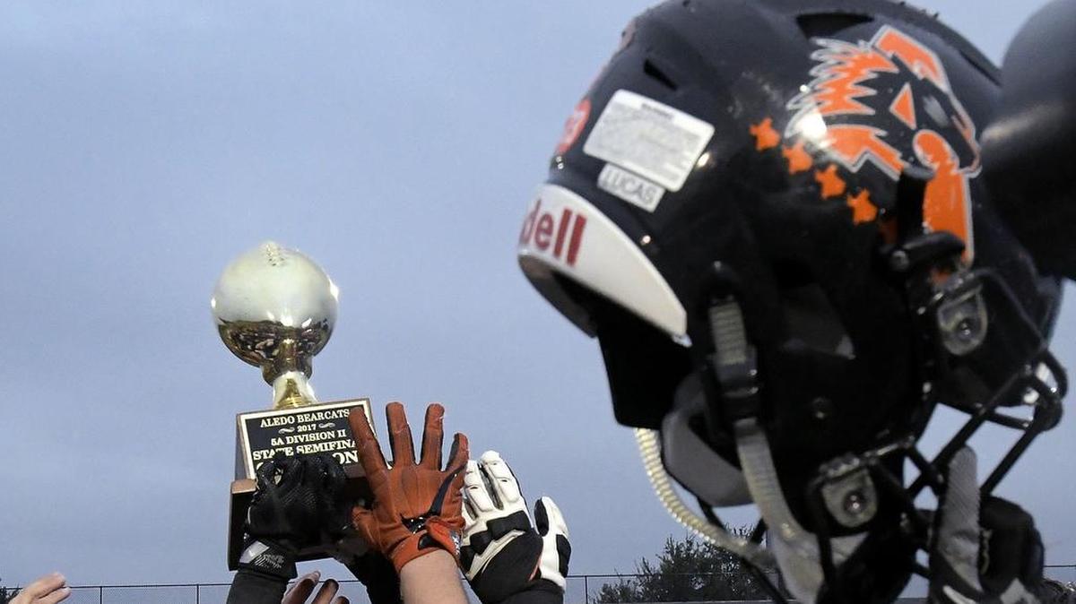Aledo Bearcats celebrate with the a 5A Division II state semifinal trophy after beating Mansfield Legacy, 28-21, Dec. 16, 2017.