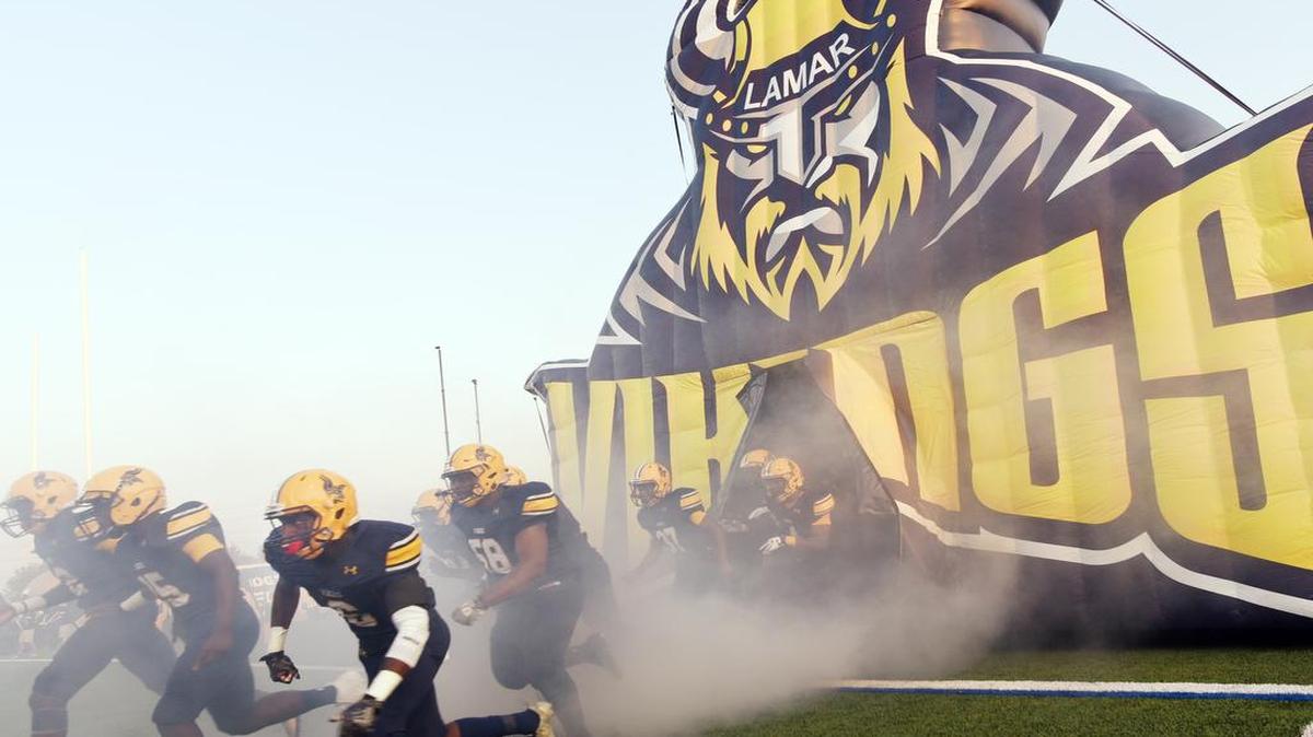 The Arlington Lamar football team takes the field before their game against Keller Fossil Ridge, Sept. 1, 2017 at Cravens Field in Arlington, Texas.