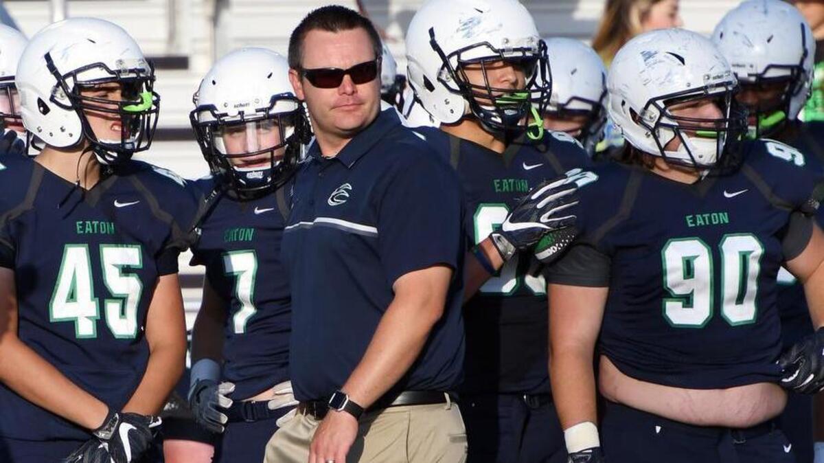 Eaton coach Ellis Miller walks the sideline during the spring game at Eaton High School in Haslet, Texas, May 20, 2017.