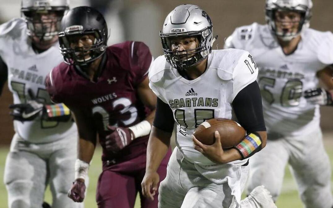 Burleson Centennial quarterback Payton Strambler (15) rushes upfield against the Mansfield Timberview Wolves in the second half of high school 5A playoff action at Newsom Stadium in Mansfield, Texas on Friday, Nov. 11, 2016.